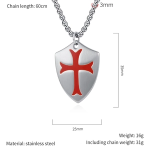 Close-up of matte stainless steel cross shield pendant with detailed size specifications