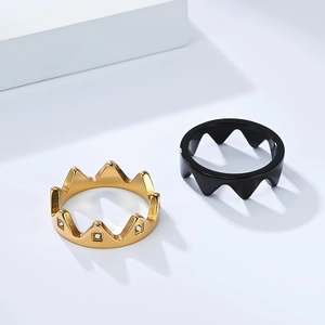 Detailed shot of detachable crown rings in gold with crystals and minimalist matte black