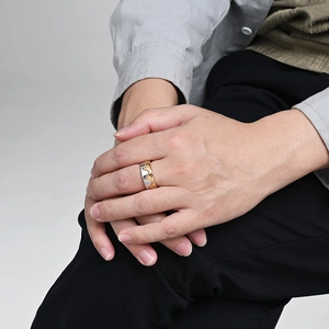 Minimalist crown-shaped interlocking ring set with cubic zirconia in two-tone gold and silver
