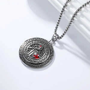 Close-up of vintage Knights Templar shield pendant with red enamel cross and steel chain