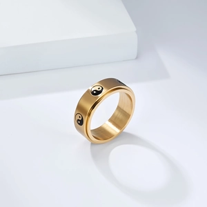 Brushed gold stainless steel spinning ring with Yin Yang Daoist pattern in Tai Chi style