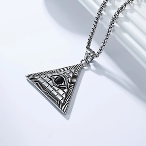 Detail shot of Eye of Horus pendant on a box chain with black gemstone and silver finish