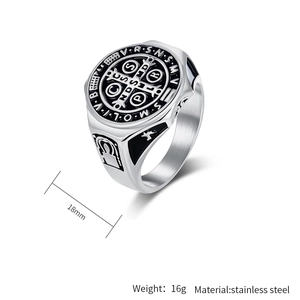 Macro view of stainless steel Saint Benedict medal ring with black enamel details