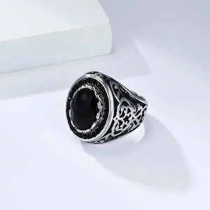Men's vintage stainless steel signet ring with large oval black stone and ornate carving