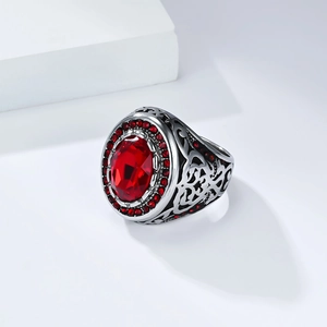 Vintage men's signet ring with red gemstone and intricate engraved vine patterns