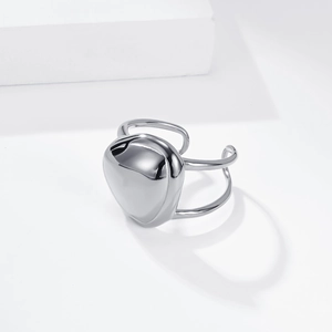 Macro detail of geometric silver titanium ring with dual-band and polished triangle top