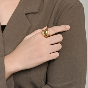 Polished gold liquid metal geometric ring for women in a minimalist heart shape style