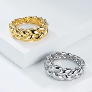 Braided twist ring in gold and silver stainless steel with a high-polished mirror finish