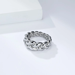 Detailed macro view of the polished twisted cable pattern on this titanium steel ring