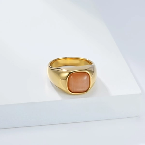 Detailed view of a gold minimalist ring featuring a square orange cat-eye stone inlay