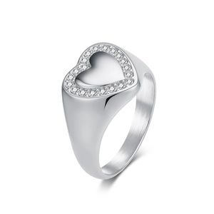 Polished silver heart-shaped ring with pavé-set sparkling crystals on a white background