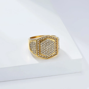 Detail of gold hexagon ring with pave-set crystals and polished mirror finish
