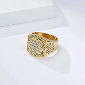 Macro view showing detailed hexagonal gold ring face with paved cubic zirconia