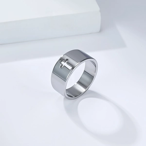 Minimalist wide cross ring in polished stainless steel with hollow design on white base