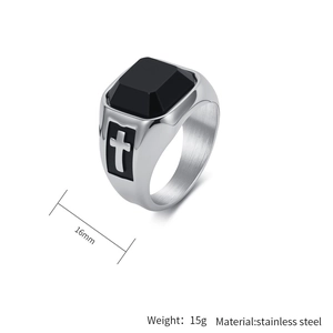 Detail view of 16mm men's stainless steel ring featuring black stone and cross engraving