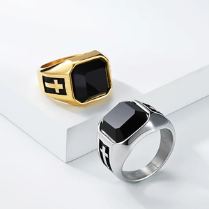 Retro mens signet ring with black gemstone and cross engraving in gold and silver