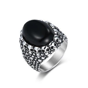 Punk style men's titanium steel ring featuring a black tiger eye stone and skull relief