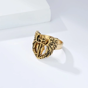 Detailed relief of Archangel Saint Michael wings and sword on a vintage gold shield ring