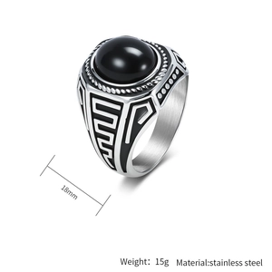 Detail of 18mm men's stainless steel signet ring with black stone and geometric texture