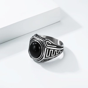 Vintage stainless steel ring for men featuring a large oval black gemstone and geometric details