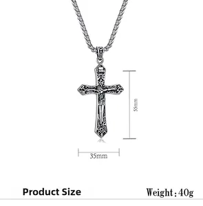 Close-up of retro stainless steel crucifix pendant with detailed Gothic carvings and INRI text