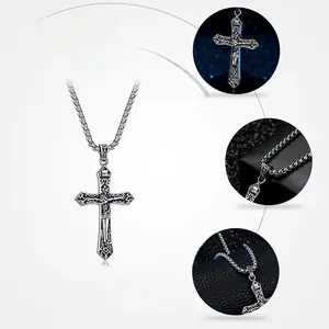 Detail view of vintage gothic sterling silver crucifix pendant with Jesus carving and floral patterns
