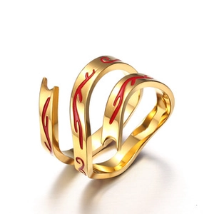 Detail of a gold layered open ring featuring vibrant red enamel wave patterns and polished finish