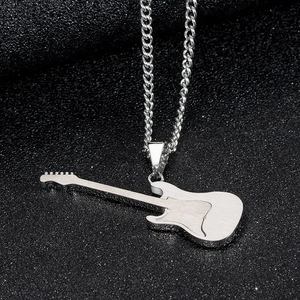 Detailed close-up of a silver titanium steel guitar pendant with brushed metal texture