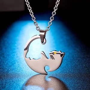 Polished stainless steel silver cat pendant necklace with smooth lines on a dark blue base