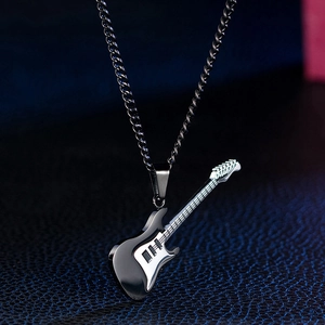 Close-up of rock style two-tone electric guitar pendant with black Cuban chain necklace