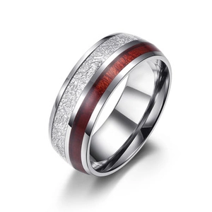Detail of silver steel ring with rustic wood inlay and meteorite texture finish