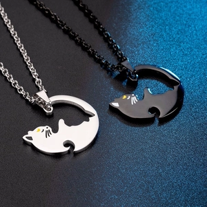 Minimalist black and white cat couple necklaces in polished stainless steel for matching lovers
