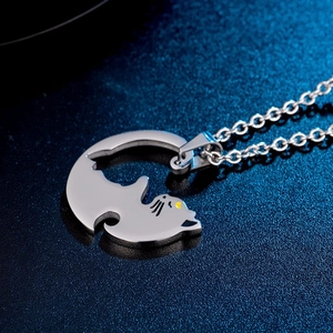 Matching cat pendant necklaces in silver steel for couples with puzzle heart design