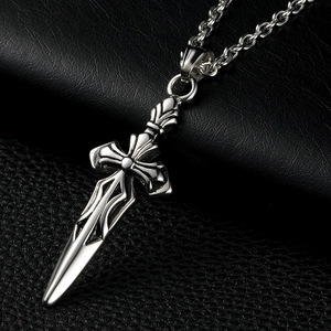 Macro shot of silver Roman heavy sword cross pendant with vintage stainless steel texture