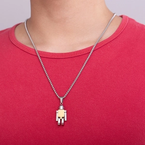 Detailed shot of a two-tone titanium robot pendant on a silver box chain necklace