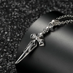 Gothic dagger sword cross pendant in polished stainless steel on black display