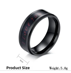 Macro view of 8mm black stainless steel ring featuring red I Love You text detail