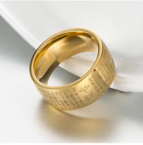Macro detail of gold-plated Buddhist Heart Sutra ring with engraved Zen characters