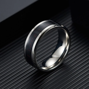 Macro shot of stainless steel temperature ring with red I Love You engraving