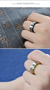 Detail of rotating titanium steel ring featuring engraved Six-Syllable Mantra characters