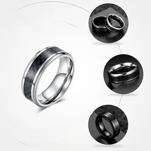 Detail view of carbon fiber inlay on polished titanium steel rings for a hip hop style