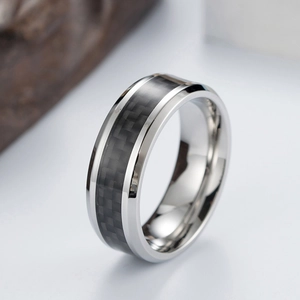 Detailed side view of men's titanium steel ring with black carbon fiber inlay design