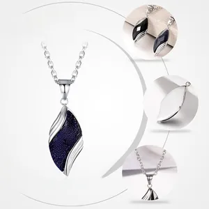 Close-up of leaf-shaped pendant with blue sandstone and black agate in 925 silver