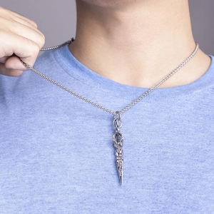 Vintage silver Vajra pestle necklace with detailed engravings on a long wheat chain