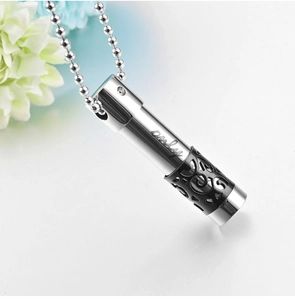 Detail of cylinder perfume bottle pendant with only engraving and hollow pattern