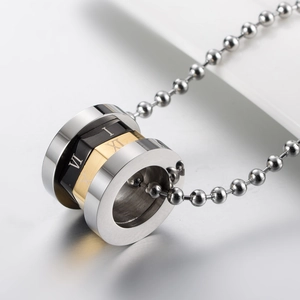 Roman numeral rotating cylinder pendant necklace in gold black and silver stainless steel