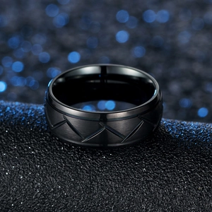 Men's matte black stainless steel ring with geometric mountain engraving and polished edges