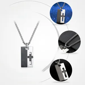 Detailed macro view of two-tone stainless steel cross pendant with brushed finish
