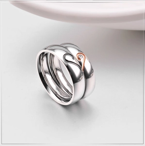 Polished stainless steel couple rings with heart puzzle design and small diamond inlay