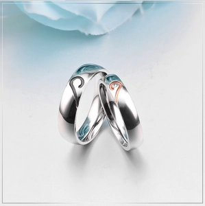 Polished stainless steel heart puzzle matching rings for couples with a single diamond